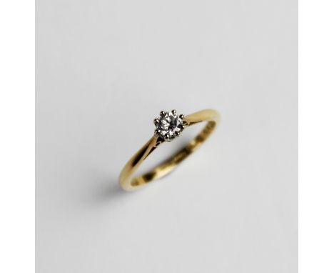 A diamond solitaire ring, the central round brilliant cut diamond weighing an estimated 0.20 carats, claw set to tapered shou