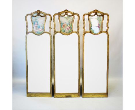 A late 19th early 20th century French gilt wood and gesso triptych screen, each panel with a moulded shell crest above a colo