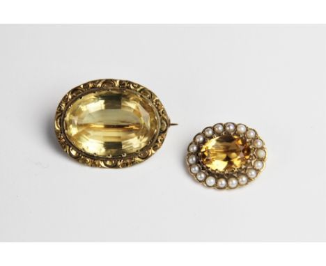 A 9ct gold citrine and pearl cluster brooch, comprising a central oval mixed cut citrine measuring 14mm x 10mm, within a bord