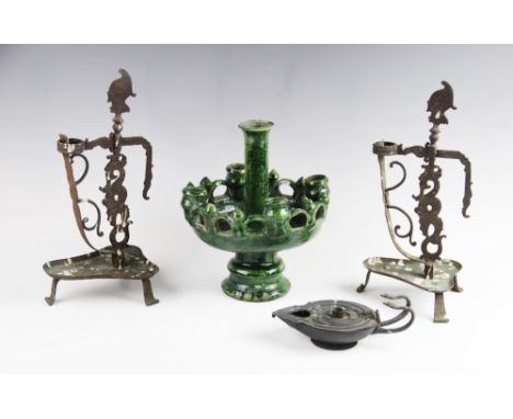 A Moroccan Tamegroute pottery sconce, of pedestal form supporting five candlesticks, 26cm high, with a pair of wrought  brass