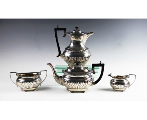 An Edwardian four piece silver tea service by Joseph Gloster Ltd, Birmingham 1907/08, comprising teapot, hot water jug, sugar