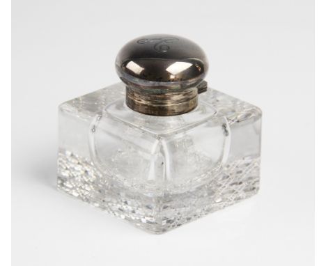 A late Victorian silver mounted cut glass inkwell by George Bedingham, London 1899, of compressed cubic form with canted edge