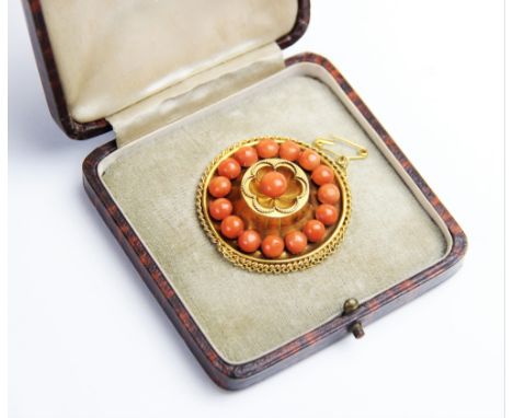 A Victorian coral set memorial target brooch, the central panel designed as a six petal flower with rope twist border set wit