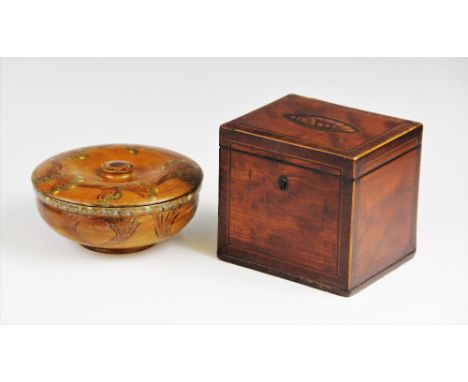A George III mahogany and rosewood tea caddy, the hinged covered with inlaid conch shell detail, the metal lined interior wit