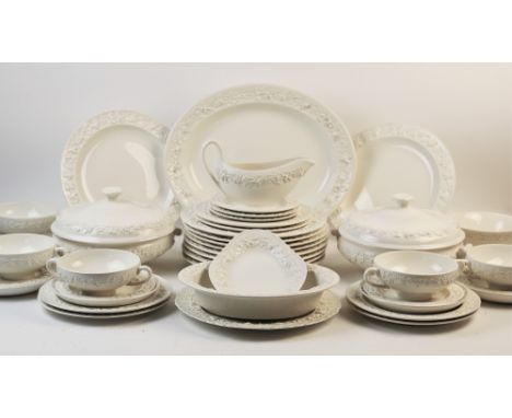 An extensive Wedgwood 'creamware' dinner service, comprising; ten dinner plates, six salad plates, nine side plates, six twin