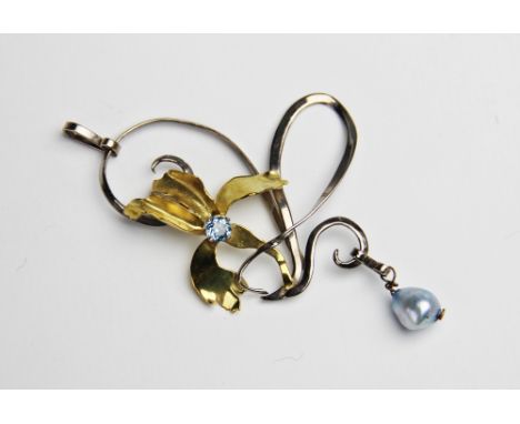 An aquamarine and pearl set 18ct gold floral pendant, comprising a central round mixed cut aquamarine measuring 4mm diameter,