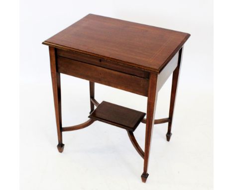 An Edwardian inlaid mahogany lady's writing desk, the moulded hinged top concealing a stationery compartment, with folding le