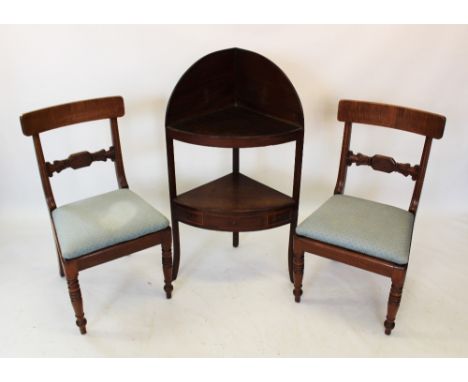 A George III mahogany corner washstand, of bowfront form, the second shelf with a single frieze drawer flanked by faux drawer