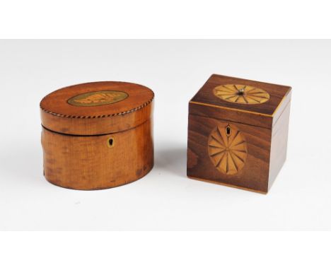 A 19th century satinwood tea caddy, of oval form, the hinged cover centred with an inlaid conch shell, within a rim inlaid wi