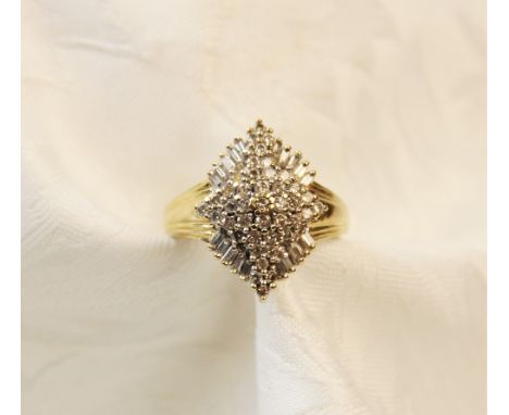 A diamond 14ct gold cluster ring, the tiered marquise shaped cluster comprising forty-one round brilliant cut diamonds with a