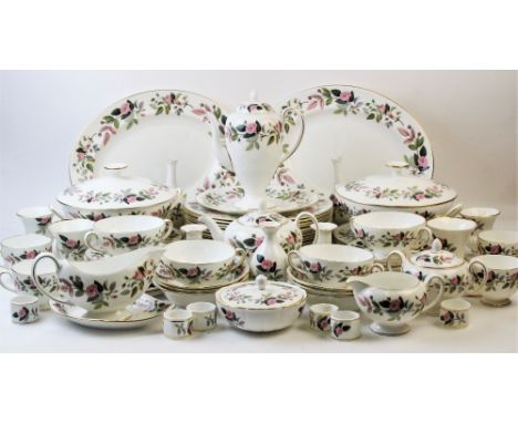 A Wedgwood dinner service in the 'Hathaway Rose' pattern, comprising; twelve dinner plates, nine salad plates, six large side