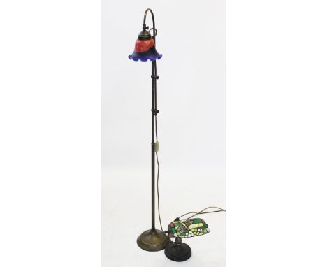 A brass floor standing adjustable reading lamp with a Tiffany style mottled glass shade, 141.5cm high (fully extended), with 