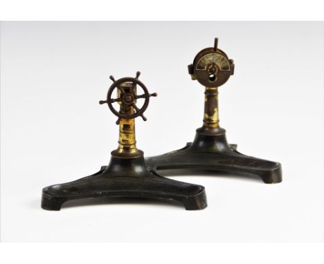 Two novelty Art Nouveau maritime themed desk ashtrays, each incorporating a cigar cutter, one modelled as a ship's wheel, the