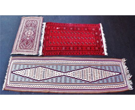 A polychrome woven tribal village runner, decorated with two central kite shaped gulls amidst a unique animal border again a 
