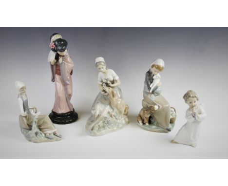 A collection of five Lladro figures, comprising: a young girl with lamb and dog, 22cm high, a young girl with a dog, 22.5cm h