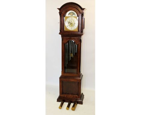 An early 20th century mahogany cased chiming longcase clock, by the Hawina Clock Co, the arched pediment above a pair of free