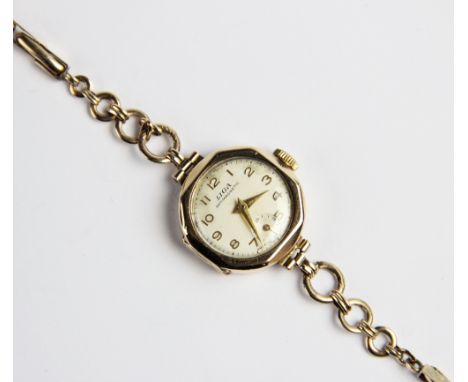 A vintage 9ct gold Liga lady's wristwatch, the circular white dial with Arabic numerals and subsidiary seconds dial to six'o'