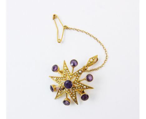 An Edwardian amethyst and seed pearl set starburst brooch pendant, designed as a six pointed star set with split seed pearls,