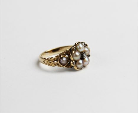 A 19th century diamond and pearl floral cluster ring, the central cluster comprising five half-pearls interspersed by small r