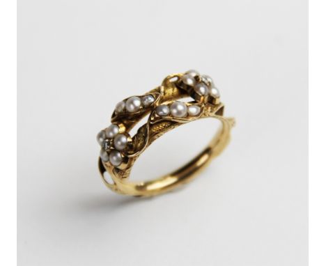 A 19th century diamond and pearl Victorian memorial ring, designed as two interwoven flowers each set with a single rose cut 