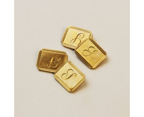 A pair of 9ct gold cufflinks, each of rectangular form with truncated corners, engine turned decoration to borders and engrav