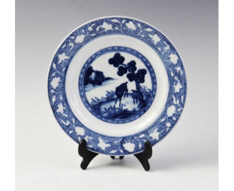 A Chinese porcelain blue and white plate, 18th century, of circular form, centrally decorated with a landscape scene featurin