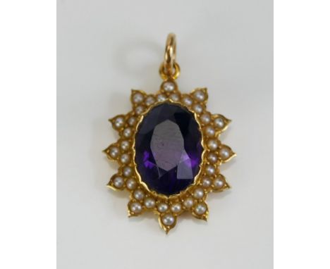 An Amethyst and Seed Pearl Pendant in a precious yellow metal setting, c. 28.4mm drop, KEE tests as 18ct, 3.38g.  UNLESS OTHE