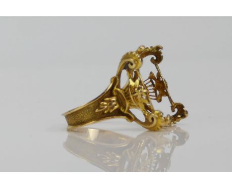 A French 18ct Gold Ornate Ring Mount with a central floral basket and scrolling corners, size K.25, to fit a c. 16.8x11.9mm s