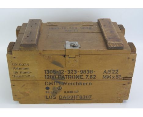 A wooden ammunition box with stenciled marks, 36cm wide. 