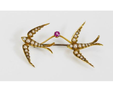 A Ruby and Seed Pearl Twin Swallow Brooch in a precious yellow metal setting, c. 49.3mm wide, KEE tests as 18ct, 4.53g.  UNLE