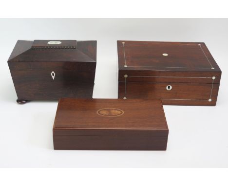 A 19th century rosewood tea caddy of sarcophagus outline, 23cm wide, together with two mahogany boxes. (3). 