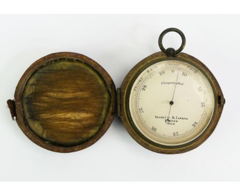 Nagretti &amp; Zambra, London, a  lacquered brass pocket barometer, No 19516, with silvered scale, 7cm diameter, contained in