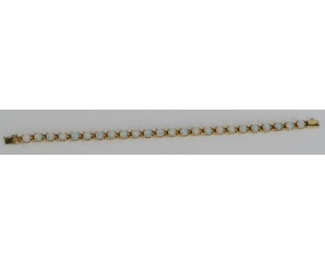 An Opal Bracelet in a yellow metal setting, 7.5" (19.5cm), stamped 4Kt, KEE tests as 14K, 14.73g.  UNLESS OTHERWISE STATED, T