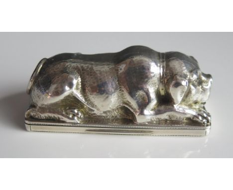 A 19th century French silver novelty snuff box, modelled as a lying mastiff, initialled, of rectangular outline, gilded inter
