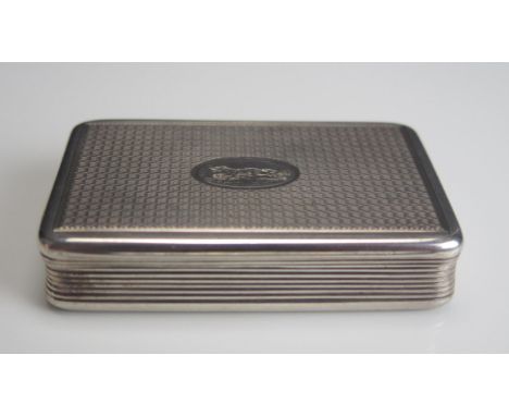 A George III silver snuff box, maker John Linnit, London, 1818, of rectangular outline, the lid with central cartouche decora