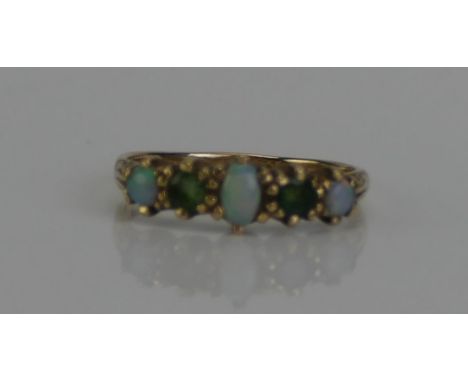 An Opal and Gem Set Five Stone Ring in a precious yellow metal setting, marks dirty, KEE tests as 9ct, size P.5, 2.41g. UNLES