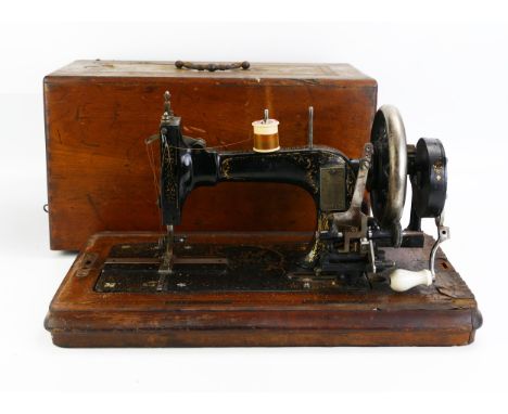 A Frister &amp; Rossman, Berlin, a manual operated sewing machine contained in a fitted case. 