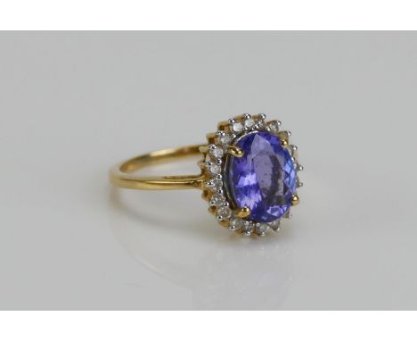 An 18ct Gold, Tanzanite and Diamond Ring, 13.1x11.7mm head, size N, hallmarked, 3.83g