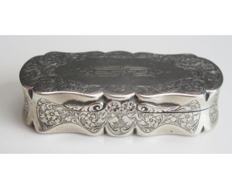 A Victorian silver snuff box, maker Colen Cheshire, Birmingham, 1896, monogrammed, of shaped oval outline, with chased foliat