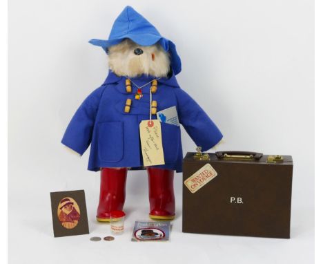 Gabrielle Designs Paddington Bear wearing a blue mackintosh and hat, red wellington boots with swing tag and silver card (mis