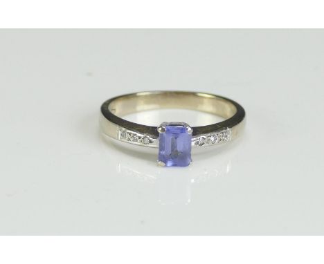 An 18ct White Gold, Tanzanite and Diamond Ring, size K, stamped 750, 3.05g. Boxed and with original receipt 
