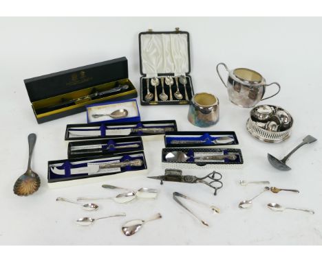 An Elizabeth II silver caddy spoon, assorted silver handled flatwares, plated flatwares, condiments, bottle coaster, etc. 