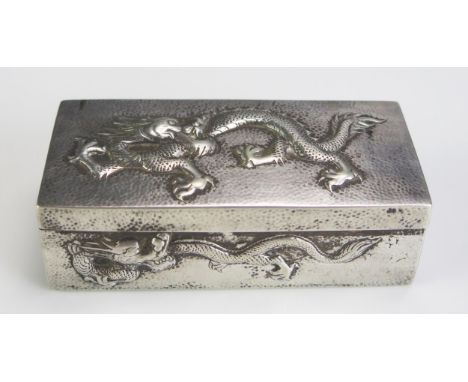 A Chinese silver rectangular snuff box, maker Wang Hing &amp; Co, Hong Kong, decorated with dragons amongst clouds, 9.25cm wi