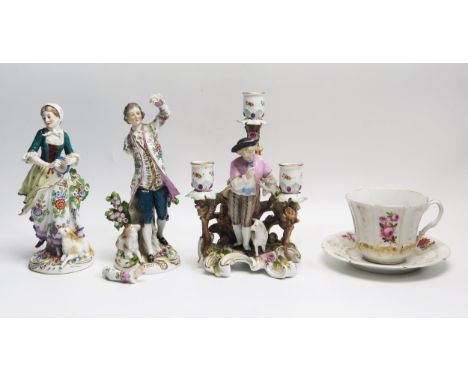 A continental porcelain figural three light candelabra, with shepherd and sheep on a scrolling base, 24cm high, a pair of fig