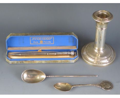 A mixed collection of silver wares including candlestick, spoons and propelling pencil. 