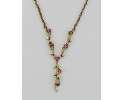A 9K Gold, Ruby and Diamond Necklace, 56mm wide central element, 30mm drop, stamped 375 9K, 7.73g 