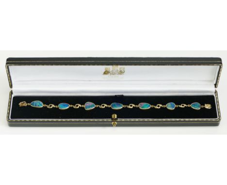 A 9K Fold and Doublet Opal Bracelet, 7.5" (19cm), stamped 375 9K, 9g. Boxed 
