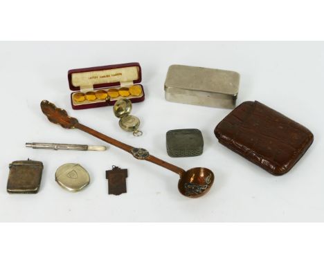 A mixed assortment of collectables including plated vesta cases, copper ladle, leather cigar case, 