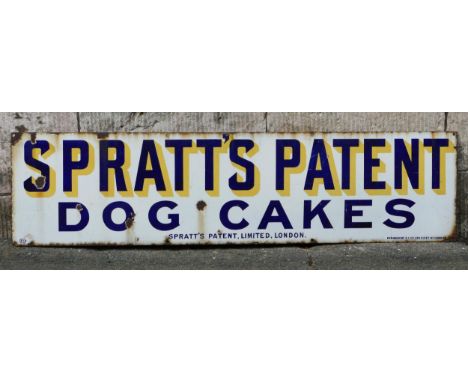 An enamel advertising sign, "Spratts Patent Dog Cakes" blue lettering to a white ground, 31cm x 122cm. 