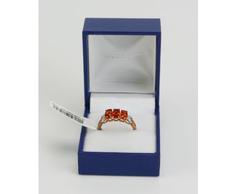 A 9ct Gold, Sunset Ruby and Diamond Ring, size P.75, hallmarked, 2.65g. As new with tag 